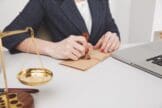 Person sealing document with wax stamp